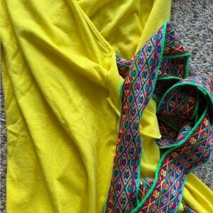 Vibrant Yellow Fabric with Colorful Patt